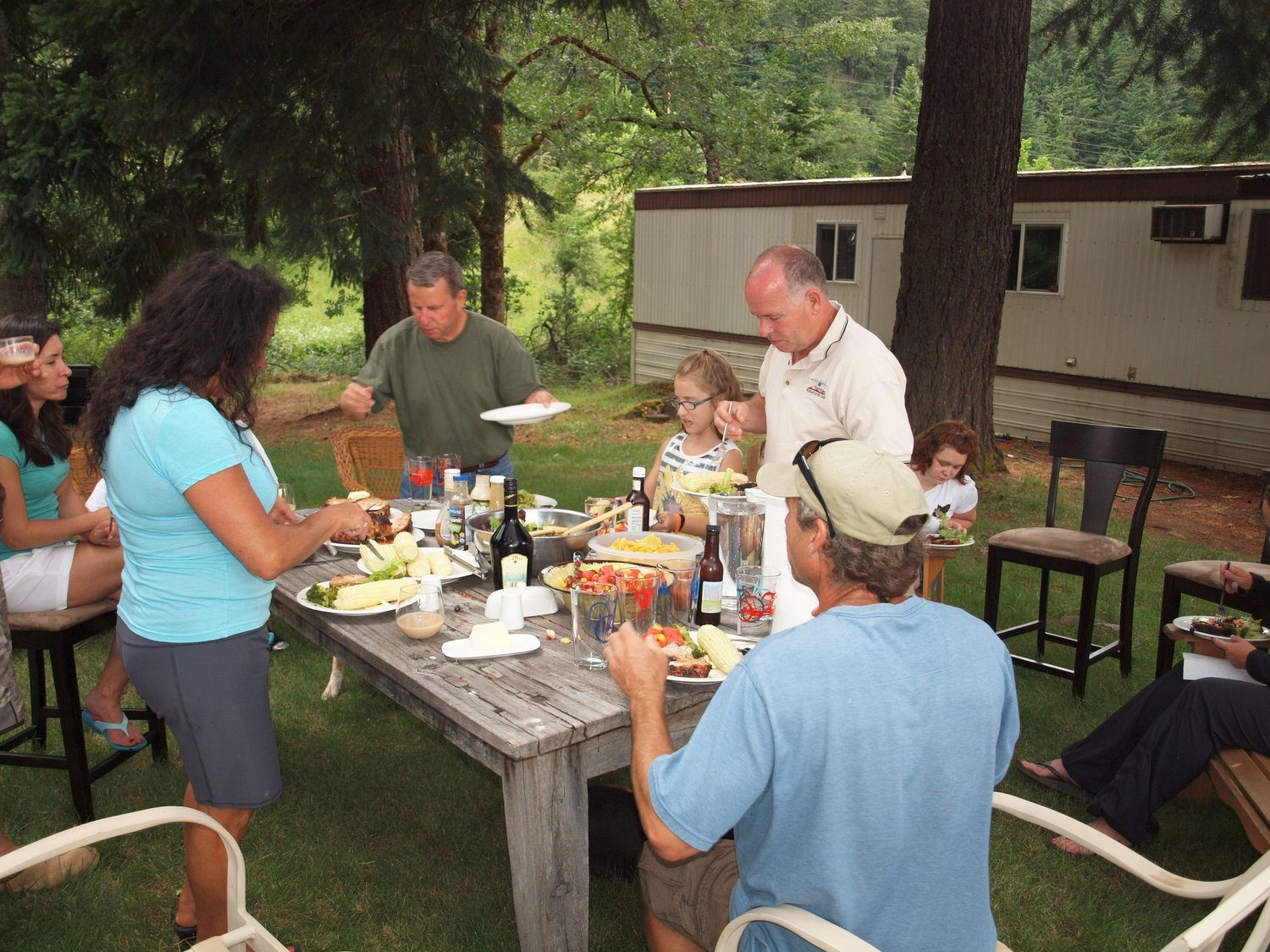 Family and friends sharing a meal at an outdoor table