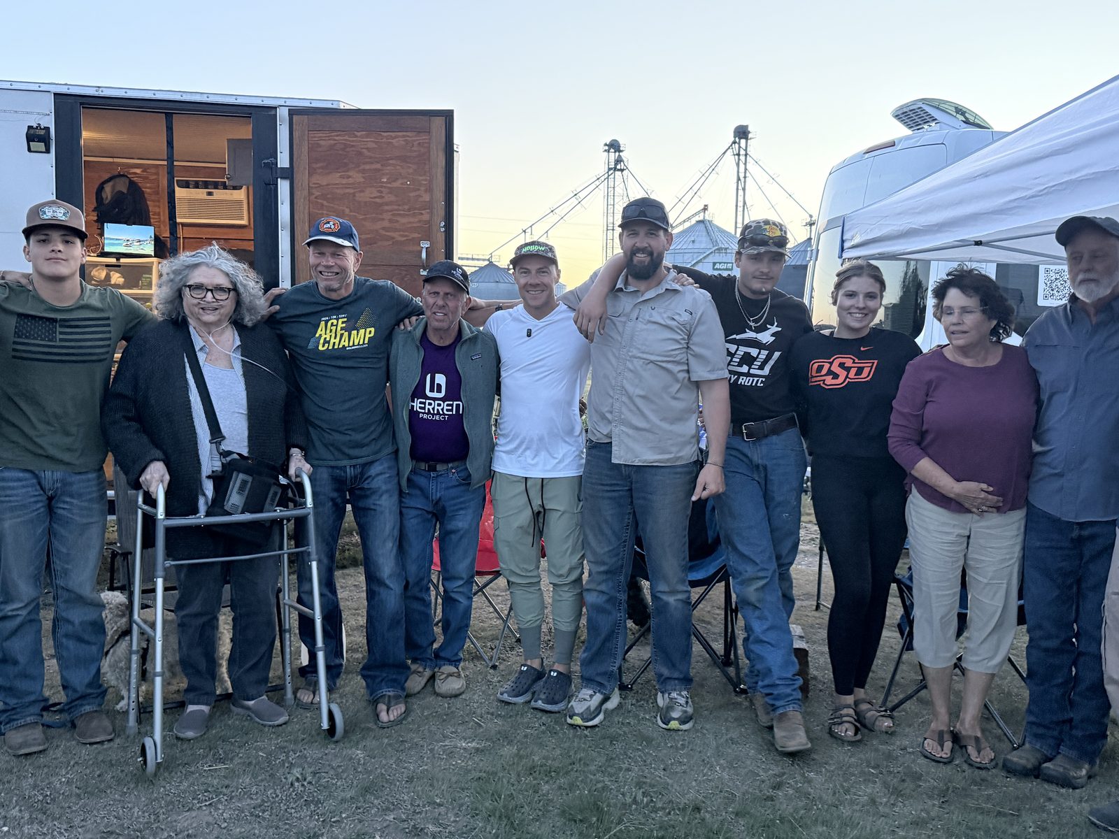 Neighbors and supporters gathered by the support trailer in a small town